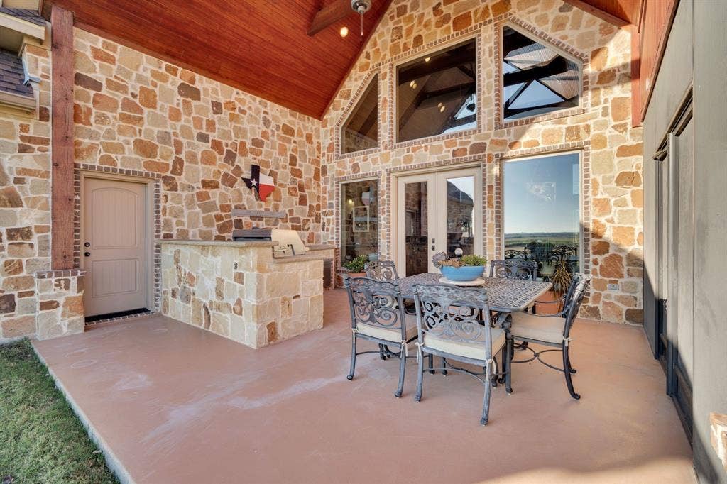 217 Hunter Pass, Waxahachie, TX 75165 View of patio featuring outdoor dining space, an outdoor kitchen, and french doors