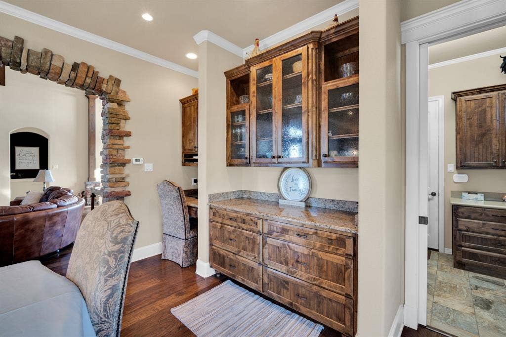 217 Hunter Pass, Waxahachie, TX 75165 Office area with ornamental molding, recessed lighting, dark wood-style flooring, and built in desk