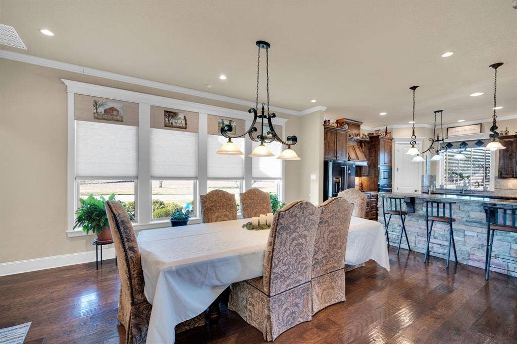 217 Hunter Pass, Waxahachie, TX 75165 Dining space with crown molding, dark wood-style floors, and recessed lighting