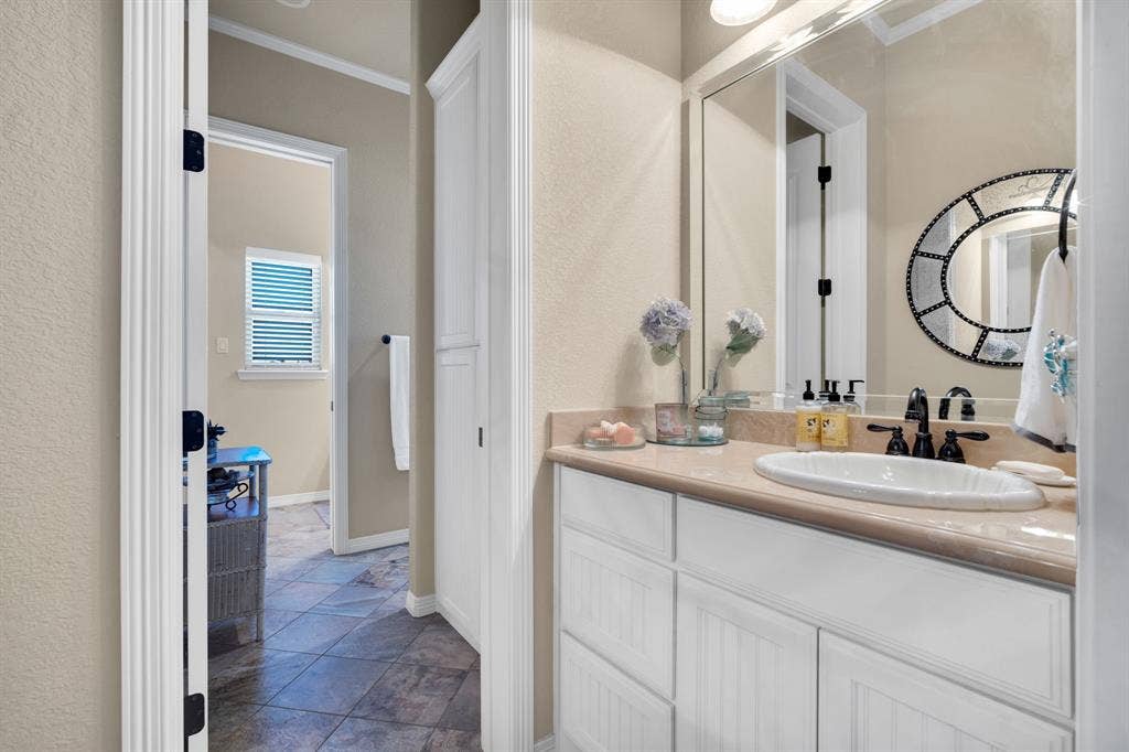 217 Hunter Pass, Waxahachie, TX 75165 Bathroom with vanity and crown molding