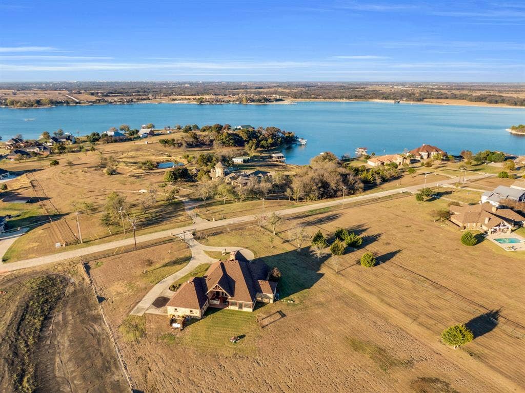 217 Hunter Pass, Waxahachie, TX 75165 Aerial overview of property's location featuring a nearby body of water
