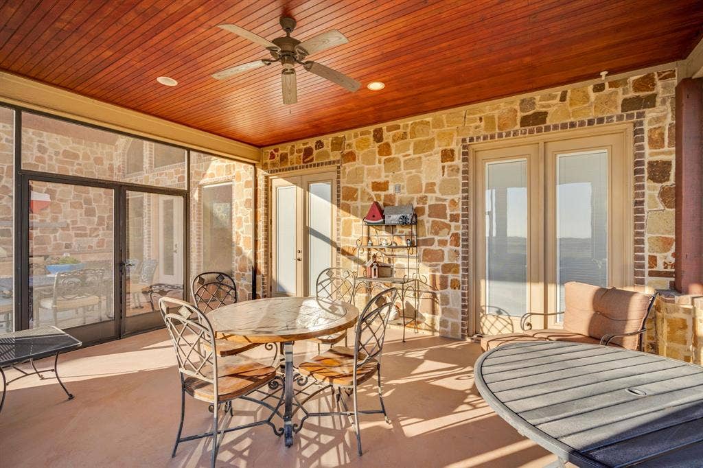 217 Hunter Pass, Waxahachie, TX 75165 Sunroom / solarium featuring outdoor dining space, a ceiling fan, and a patio