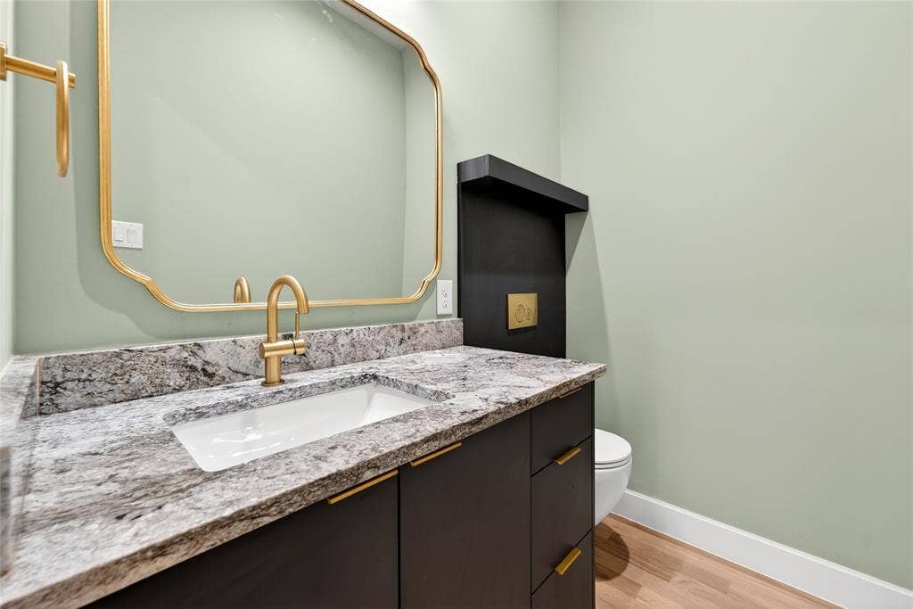 6603 Roper Street, Dallas, TX 75209 Downstairs powder bath with wall mounted comode.
