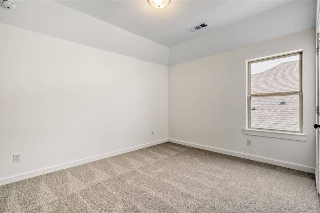 2228 Prickly Cactus Drive, Forney, TX 75126 Spare room with light carpet and baseboards
