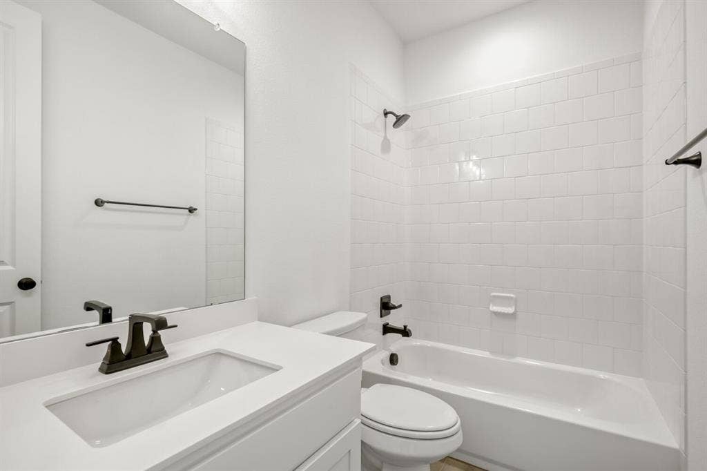 2228 Prickly Cactus Drive, Forney, TX 75126 Full bathroom featuring vanity and washtub / shower combination