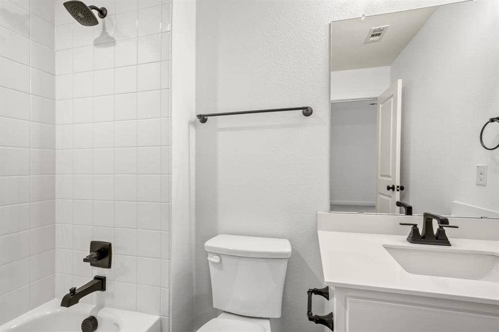 2228 Prickly Cactus Drive, Forney, TX 75126 Bathroom featuring vanity and shower / bathtub combination