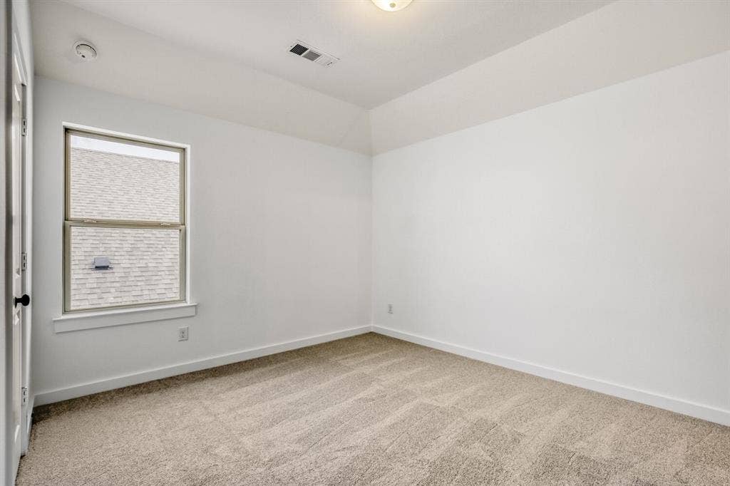 2228 Prickly Cactus Drive, Forney, TX 75126 Spare room featuring baseboards and light colored carpet