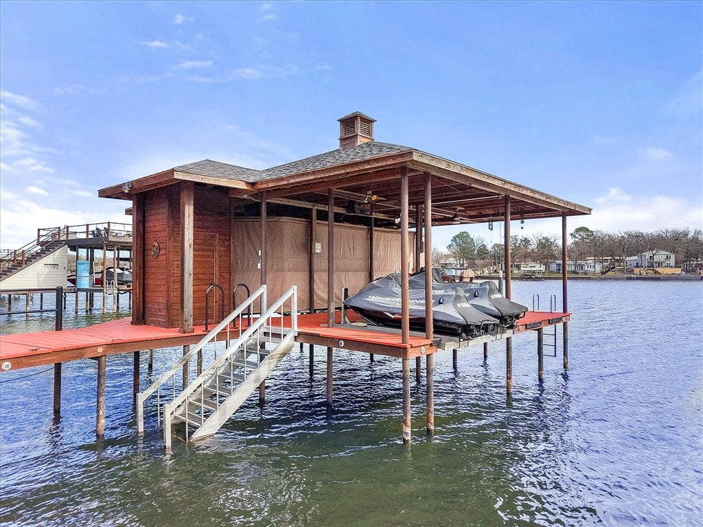 110 Northwood Place, Enchanted Oaks, TX 75156 Dock area featuring boat lift and a water view