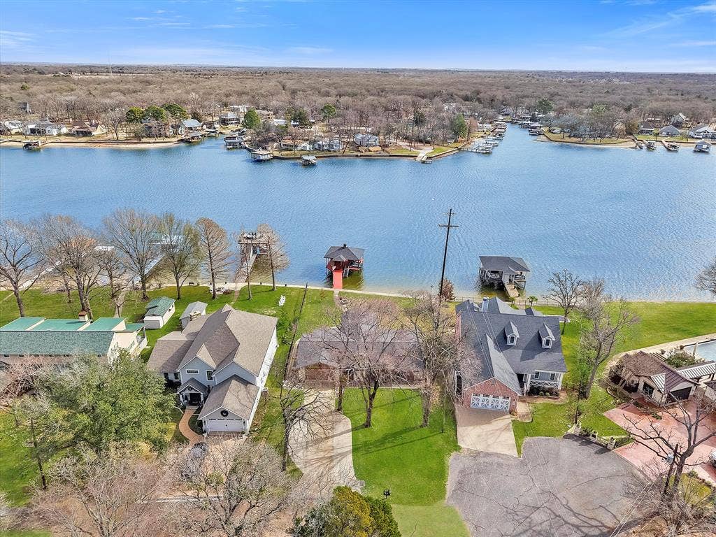 110 Northwood Place, Enchanted Oaks, TX 75156 Aerial perspective of suburban area with a large body of water