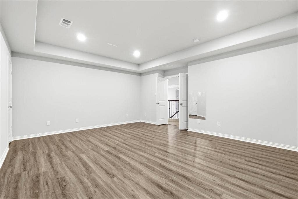 3860 Dewberry Lane, Prosper, TX 75078 Media room with new luxury vinyl planks
