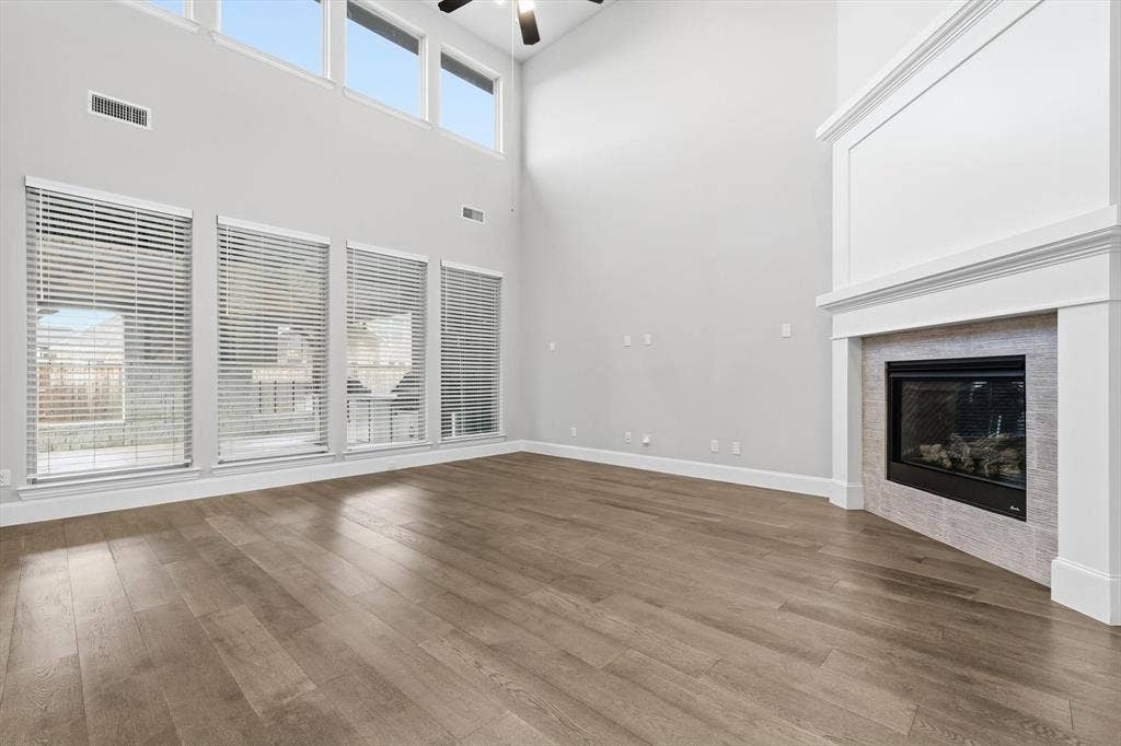 3860 Dewberry Lane, Prosper, TX 75078 Living room with gas fireplace