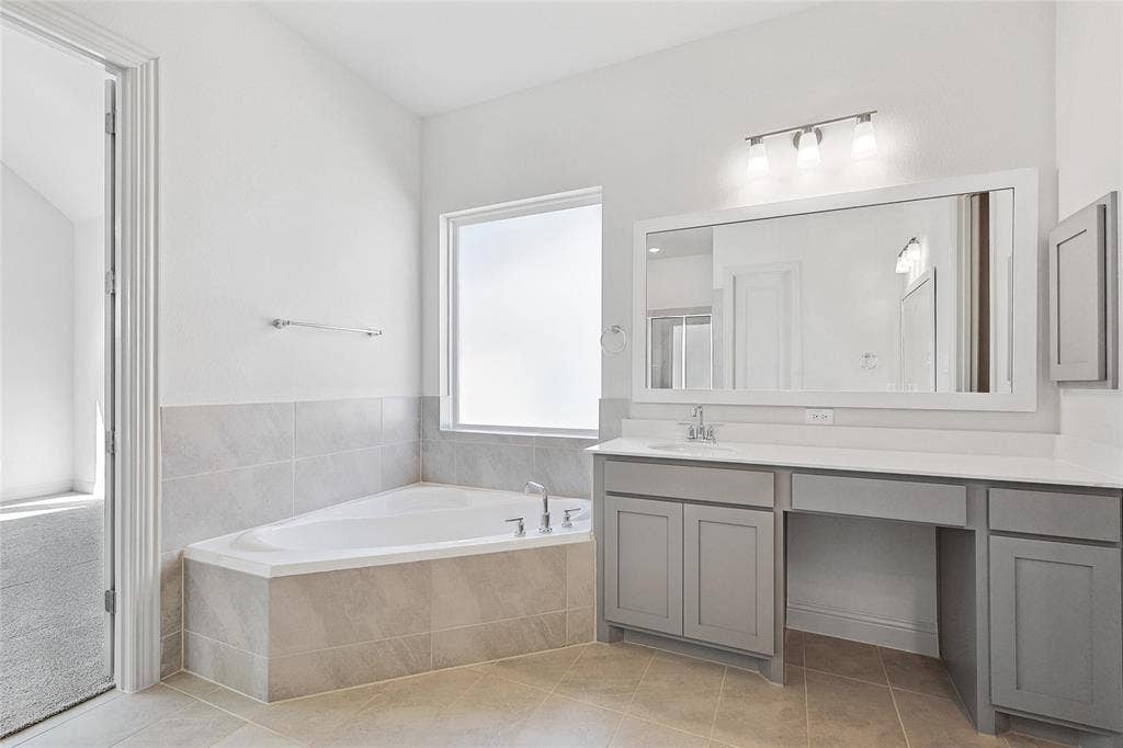 313 Trinity Court, Shady Shores, TX 76208 Full bath featuring a garden tub, vanity, a shower stall, and light tile patterned floors