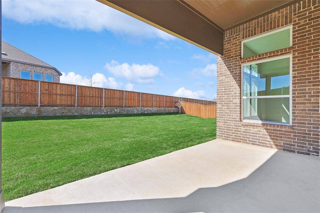 313 Trinity Court, Shady Shores, TX 76208 Fenced backyard with a patio