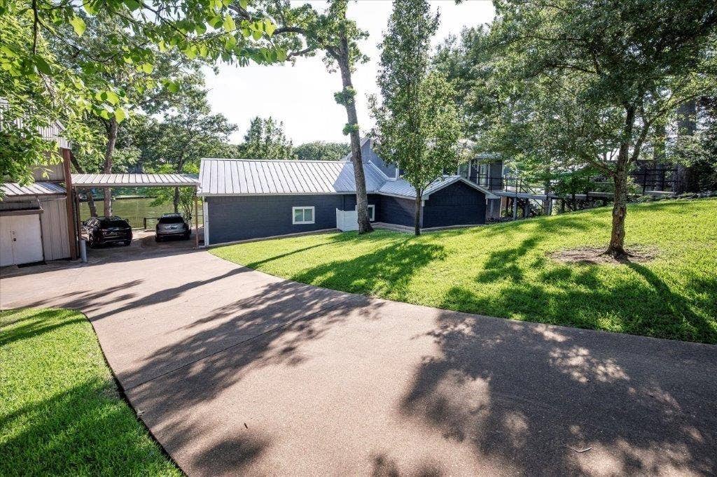 154 Bayside Circle, Malakoff, TX 75148 Plenty of parking for several vehicles including covered RV parking with electric hook up.