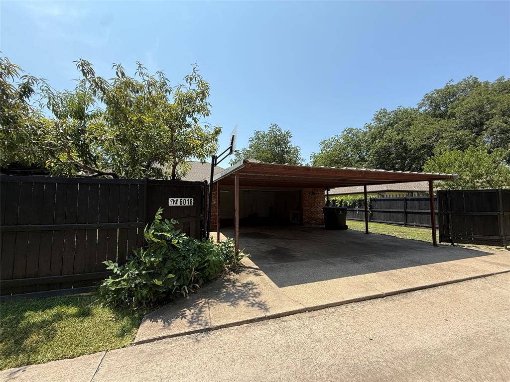 6018 Raleigh Drive, Garland, TX 75044 Attached carport with a metal roof