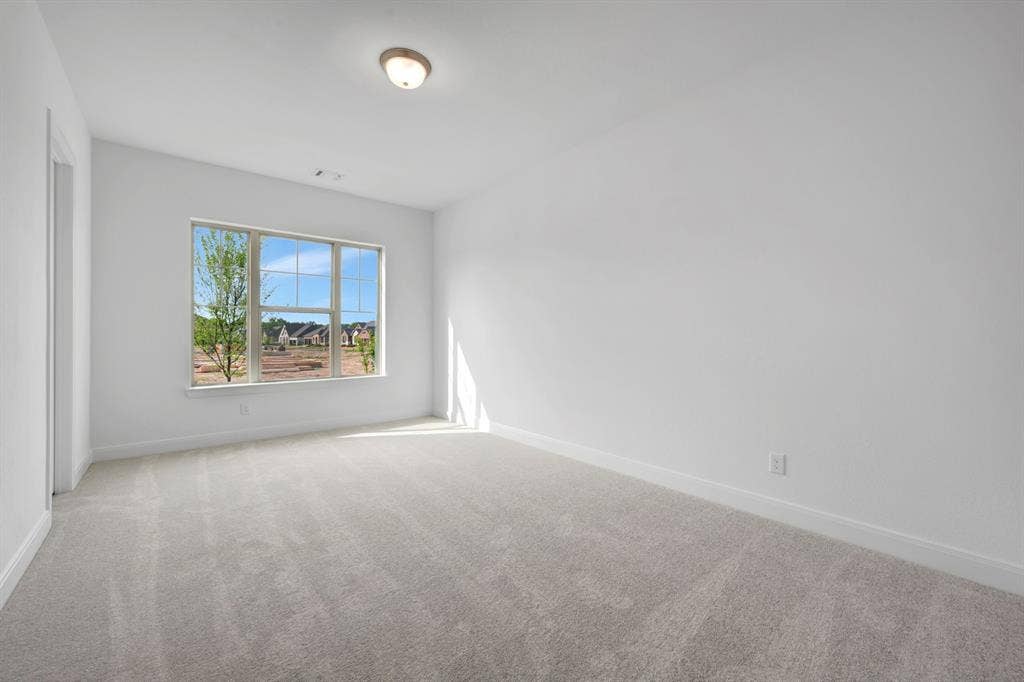 2079 Emerald Grove Lane, Arlington, TX 76005 Spare room with light colored carpet and baseboards