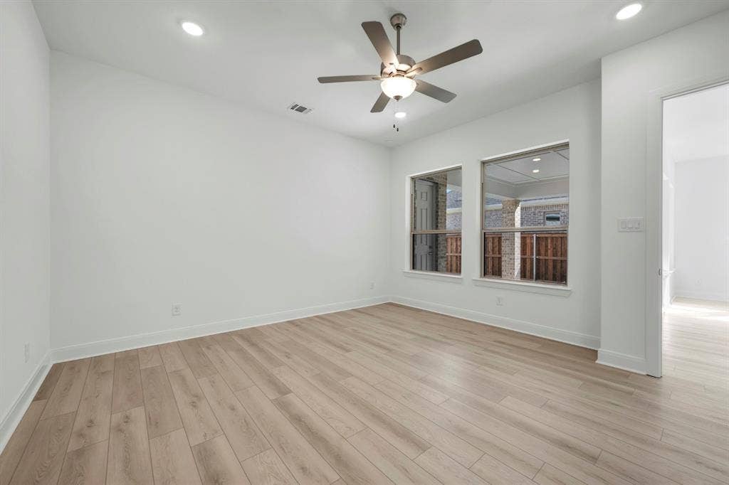 2079 Emerald Grove Lane, Arlington, TX 76005 Unfurnished room with a ceiling fan, recessed lighting, and light wood-style flooring