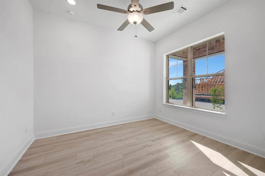 2079 Emerald Grove Lane, Arlington, TX 76005 Empty room featuring light wood finished floors, ceiling fan, and recessed lighting