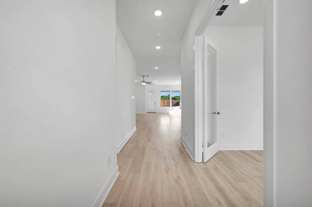 2079 Emerald Grove Lane, Arlington, TX 76005 Hall with light wood finished floors and recessed lighting