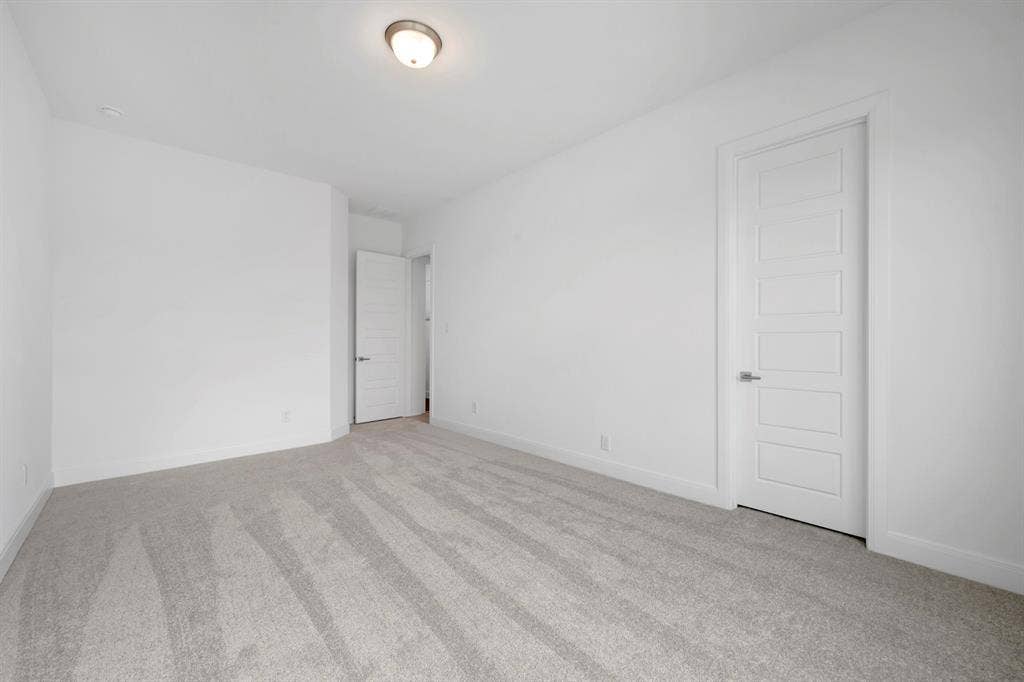 2079 Emerald Grove Lane, Arlington, TX 76005 Spare room featuring light colored carpet and baseboards