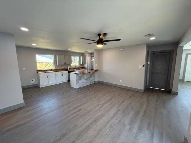 5845 Haney Drive, Watauga, TX 76148 Kitchen with open floor plan, a peninsula, recessed lighting, dark wood-style floors, and a ceiling fan
