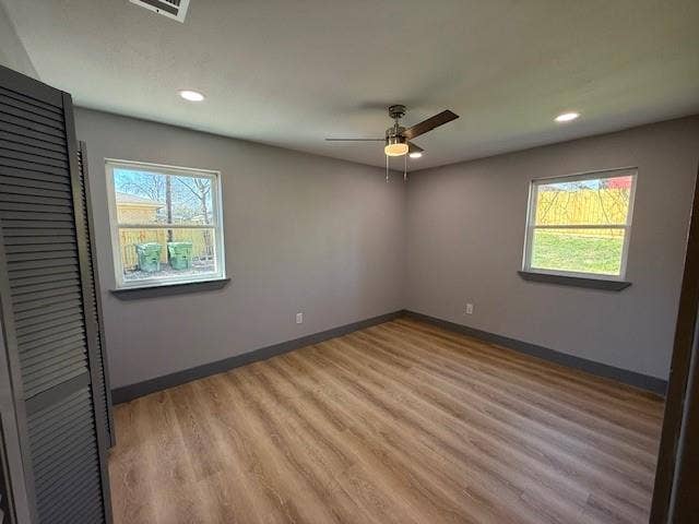 5845 Haney Drive, Watauga, TX 76148 Spare room featuring light wood-type flooring, ceiling fan, healthy amount of natural light, and recessed lighting