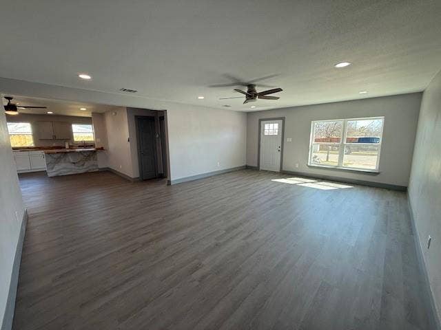 5845 Haney Drive, Watauga, TX 76148 Unfurnished living room with ceiling fan, dark wood-style floors, plenty of natural light, and recessed lighting