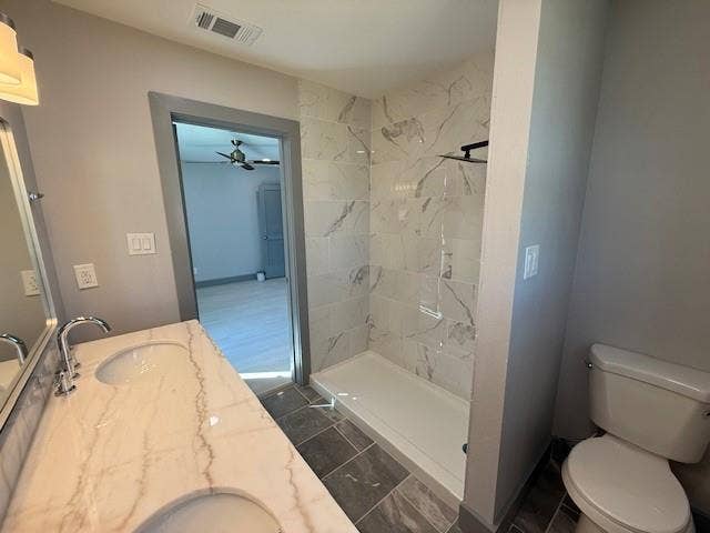 5845 Haney Drive, Watauga, TX 76148 Full bath with double vanity, a stall shower, and ceiling fan