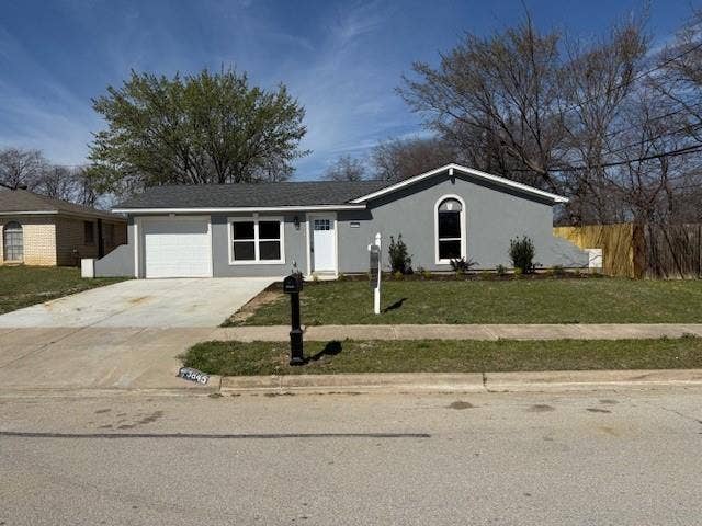 5845 Haney Drive, Watauga, TX 76148 Ranch-style home featuring driveway, stucco siding, and an attached garage