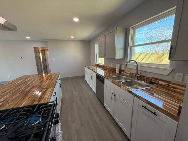 5845 Haney Drive, Watauga, TX 76148 Kitchen with wood counters, gas stove, dark wood-style flooring, range hood, and recessed lighting