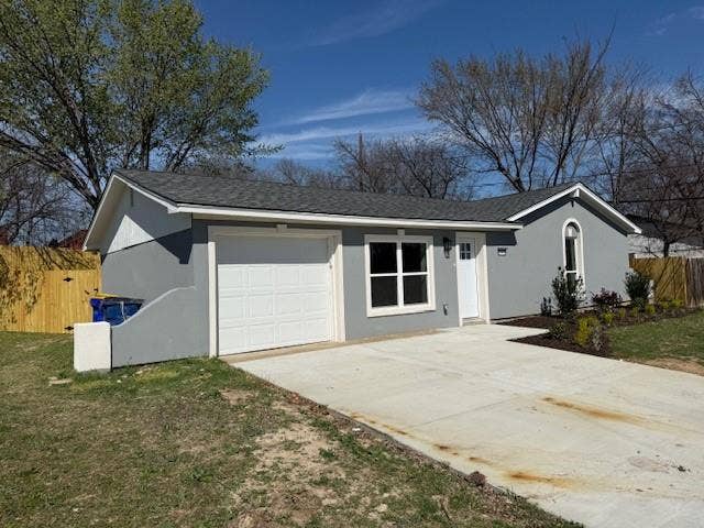 5845 Haney Drive, Watauga, TX 76148 Ranch-style home featuring concrete driveway, stucco siding, and an attached garage