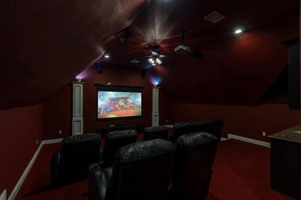 5182 Bayshore Drive, Athens, TX 75752 Cinema with a ceiling fan and dark carpet
