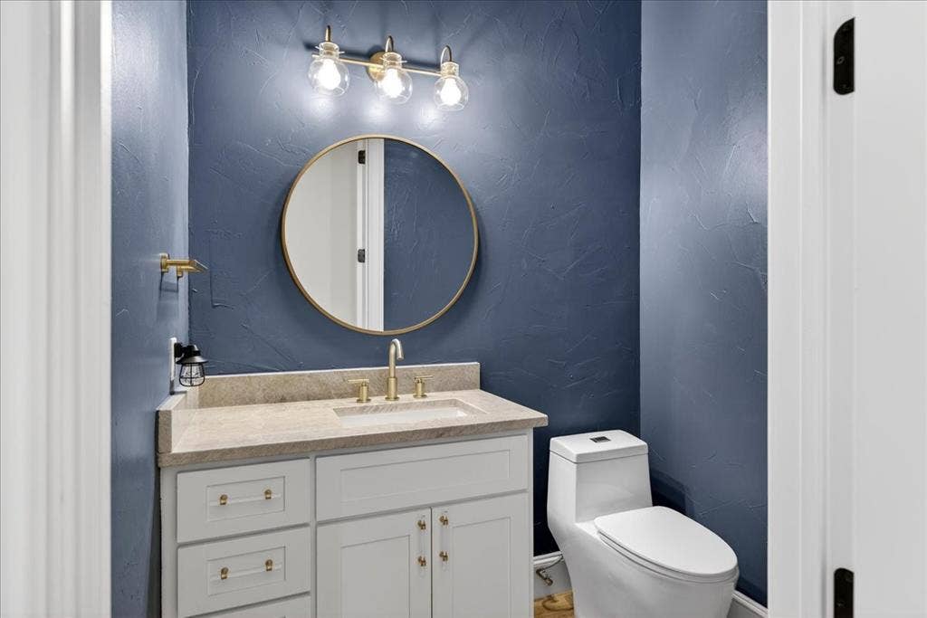 5182 Bayshore Drive, Athens, TX 75752 Half bathroom with a textured wall and vanity