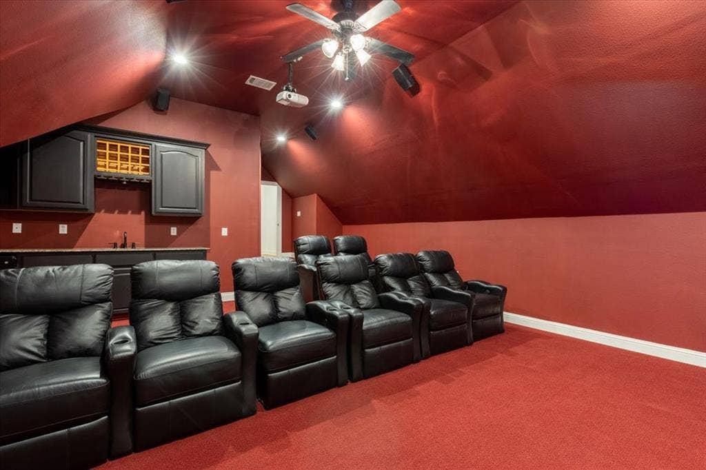 5182 Bayshore Drive, Athens, TX 75752 Cinema with dark carpet and baseboards