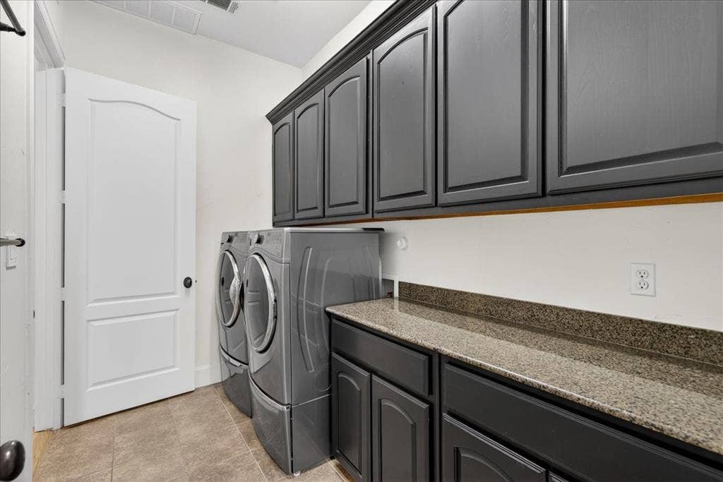 5182 Bayshore Drive, Athens, TX 75752 Laundry area with separate washer and dryer and cabinet space