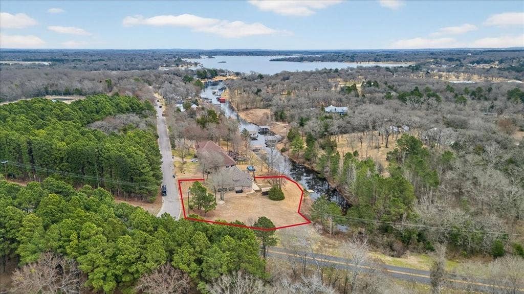 5182 Bayshore Drive, Athens, TX 75752 Aerial view of property and surrounding area with a heavily wooded area and property boundaries highlighted