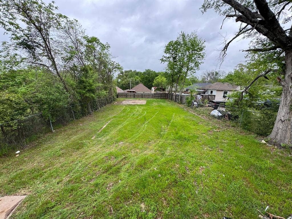 1309 Emma Street, Tyler, TX 75701 View of yard featuring view of scattered trees