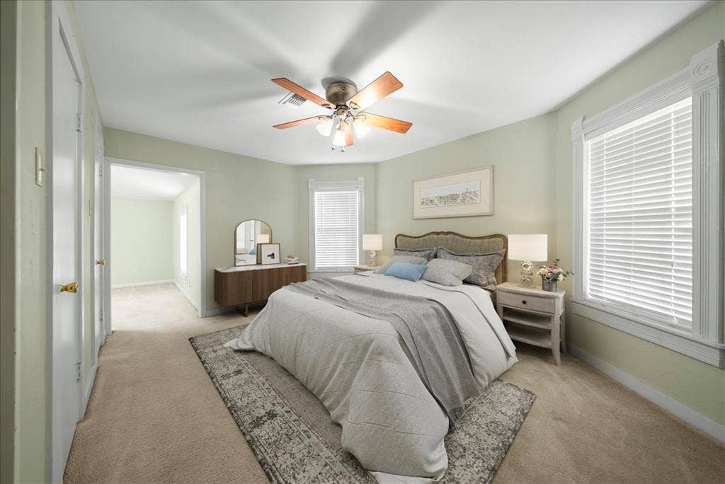 101 N 7th Street, Krum, TX 76249 Carpeted bedroom with ceiling fan and baseboards