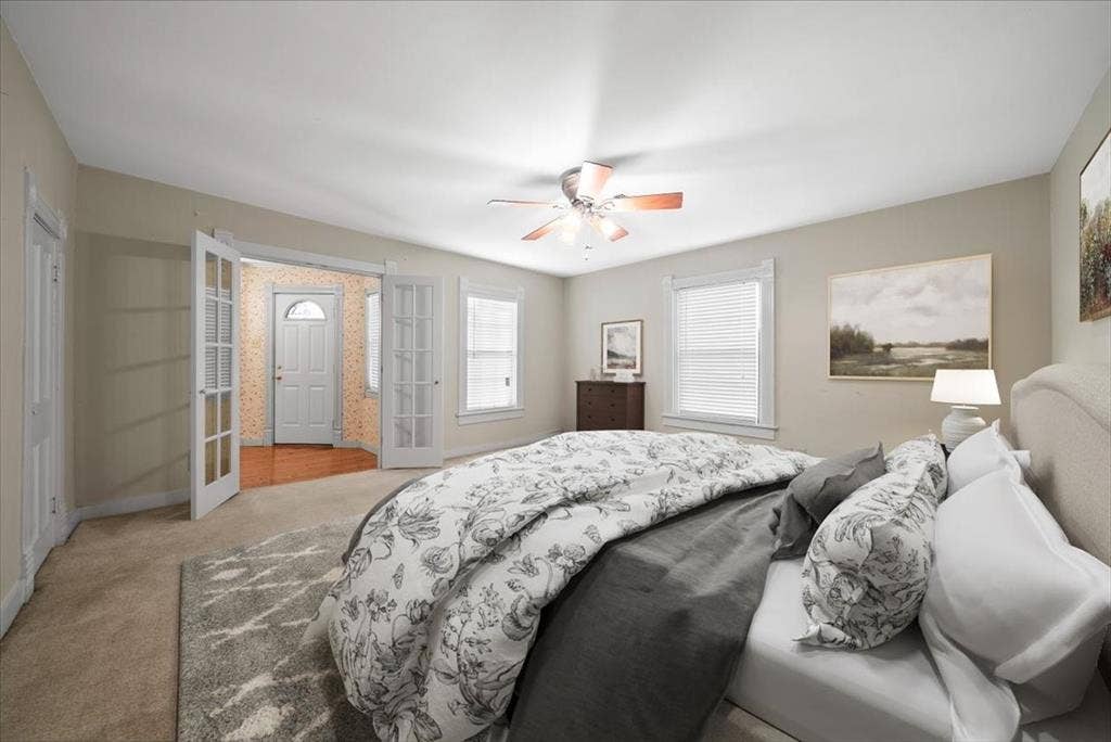 101 N 7th Street, Krum, TX 76249 Carpeted bedroom featuring ceiling fan and baseboards