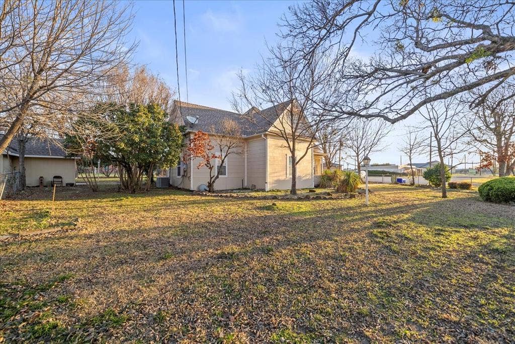 101 N 7th Street, Krum, TX 76249 View of property exterior with a lawn