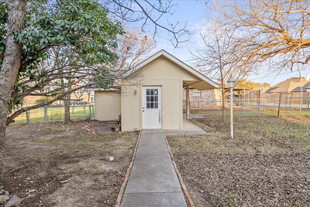 101 N 7th Street, Krum, TX 76249 View of outdoor structure featuring a fenced backyard
