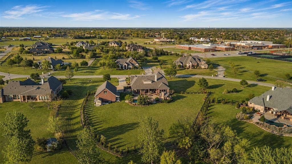 Expansive suburban landscape featuring multiple residences on large lots