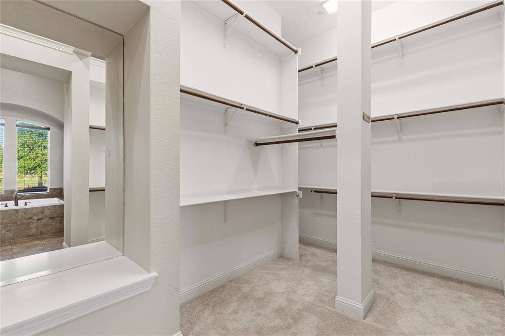 Floor to Ceiling shelving/closet space.
