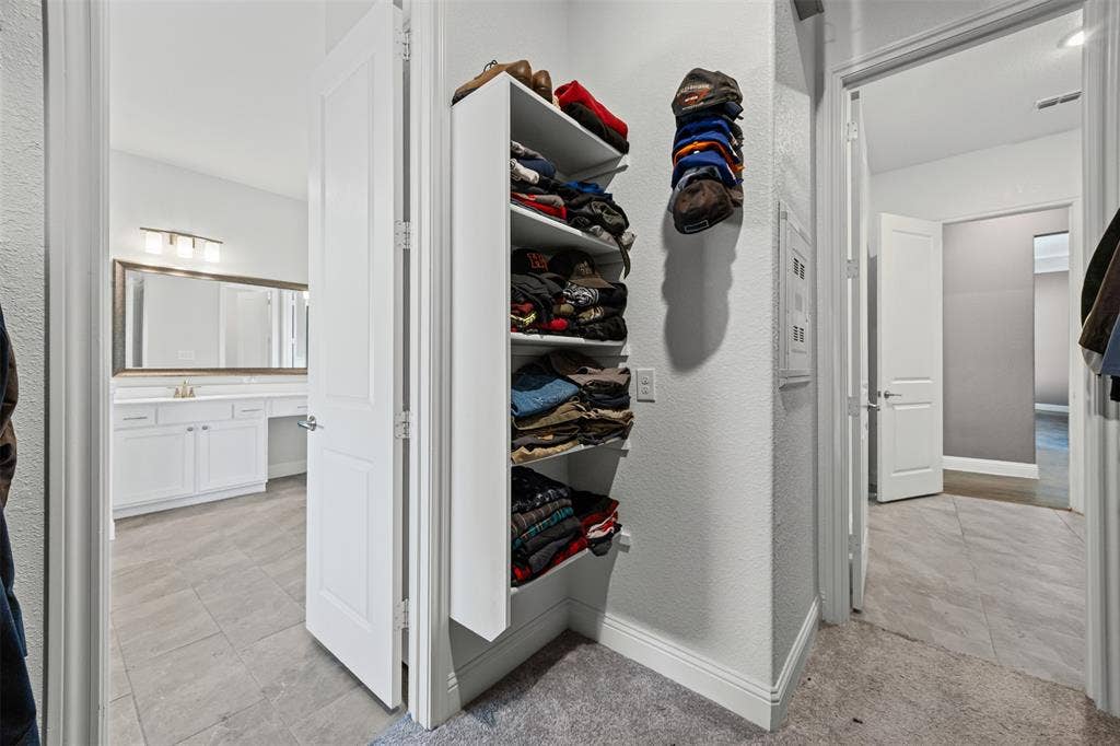 117 Vail Lane, Waxahachie, TX 75167 Flow from primary bath to closet to laundry room
