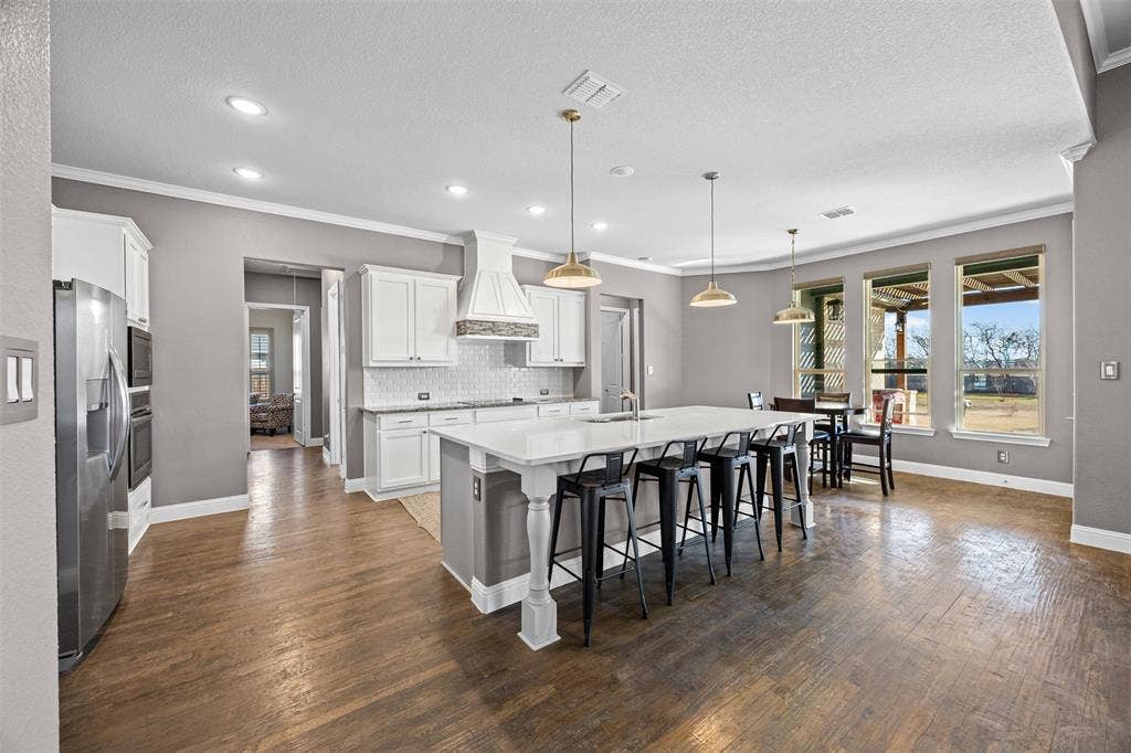 117 Vail Lane, Waxahachie, TX 75167 Kitchen and breakfast area with view of backyard