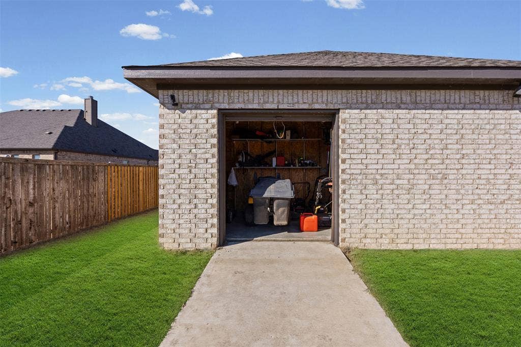 117 Vail Lane, Waxahachie, TX 75167 Storage area for yard tools in the back of the shop
