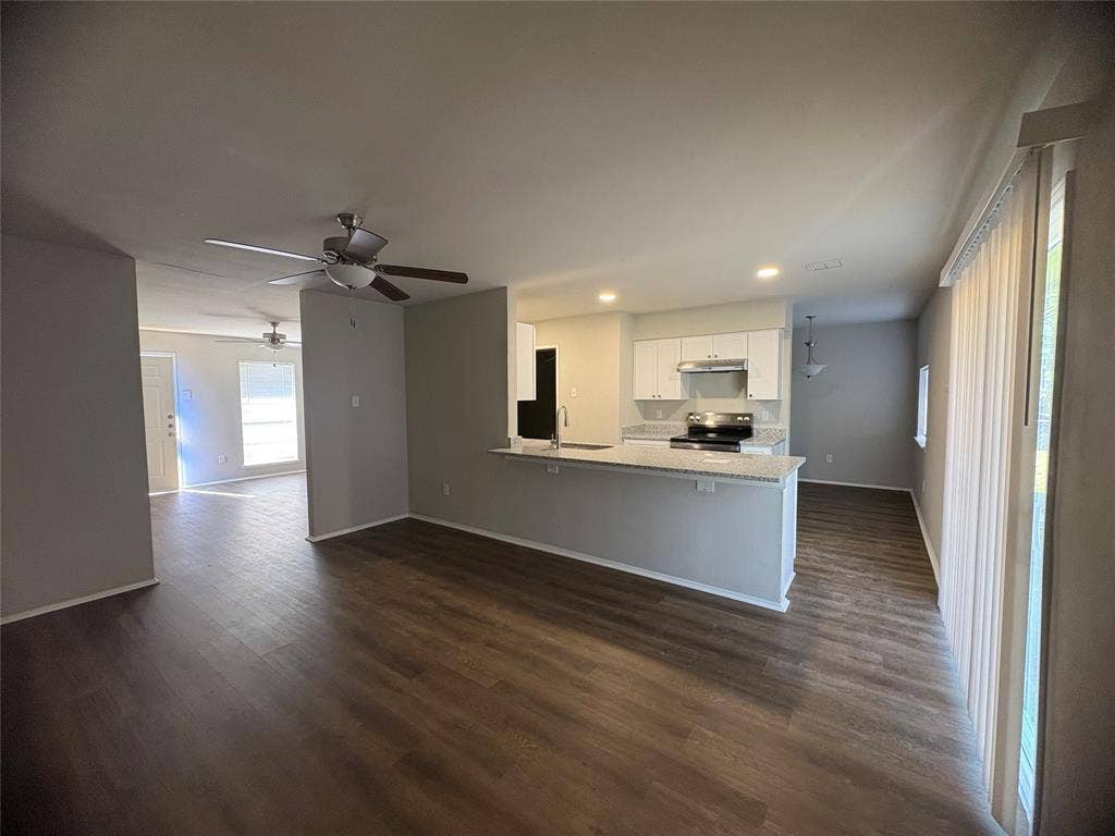 117 Yorkshire Drive, Cedar Hill, TX 75104 Kitchen with white cabinets, open floor plan, a peninsula, recessed lighting, and dark wood-style flooring