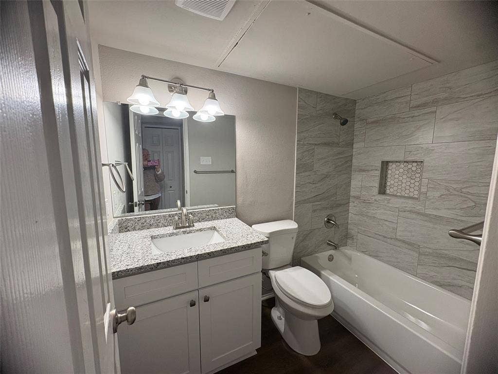 117 Yorkshire Drive, Cedar Hill, TX 75104 Full bathroom featuring shower / washtub combination, vanity, and a textured wall
