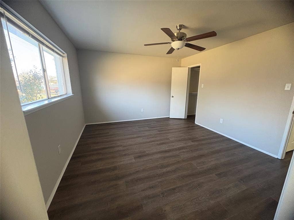 117 Yorkshire Drive, Cedar Hill, TX 75104 Unfurnished master bedroom with dark wood-type flooring and a ceiling fan private bathroom and WIC