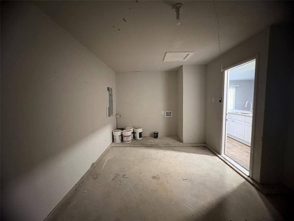 117 Yorkshire Drive, Cedar Hill, TX 75104 Laundry area in garage off ,with attic access and electric panel single car garage entrance